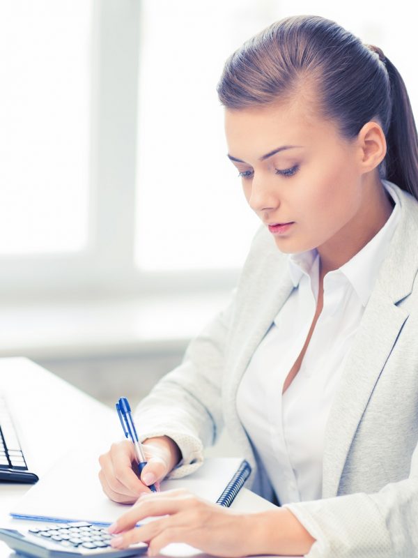 businesswoman-with-notebook-and-calculator.jpg
